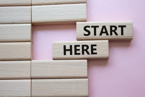 wodden blocks that read "start here."